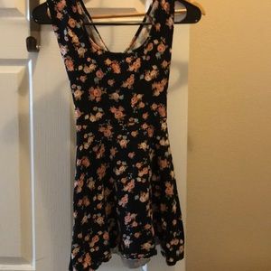black dress with rose design and design in back